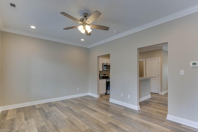unfurnished room featuring baseboards, a ceiling fan, visible vents, and light wood-style flooring