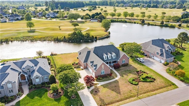 birds eye view of property with a water view, golf course view, and a residential view