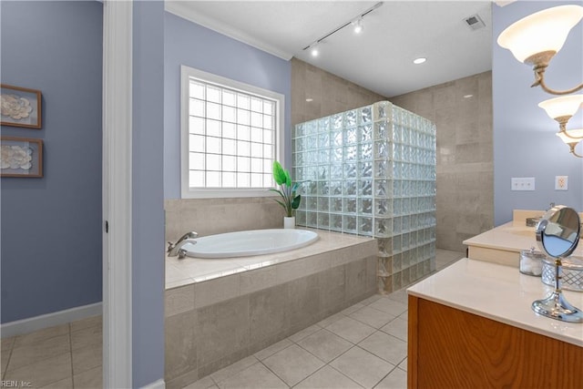 bathroom with a walk in shower, tile patterned flooring, rail lighting, visible vents, and a garden tub