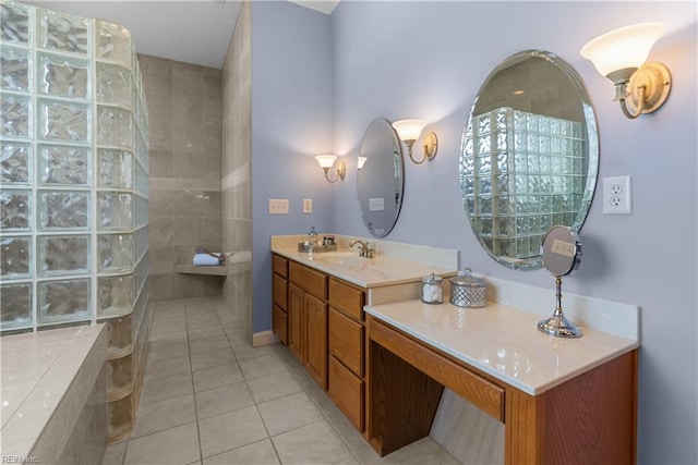 bathroom with a walk in shower, tile patterned flooring, and vanity