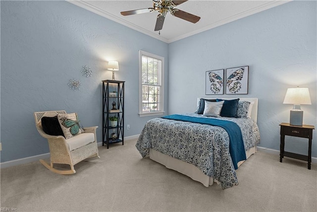 bedroom with carpet floors, baseboards, and crown molding