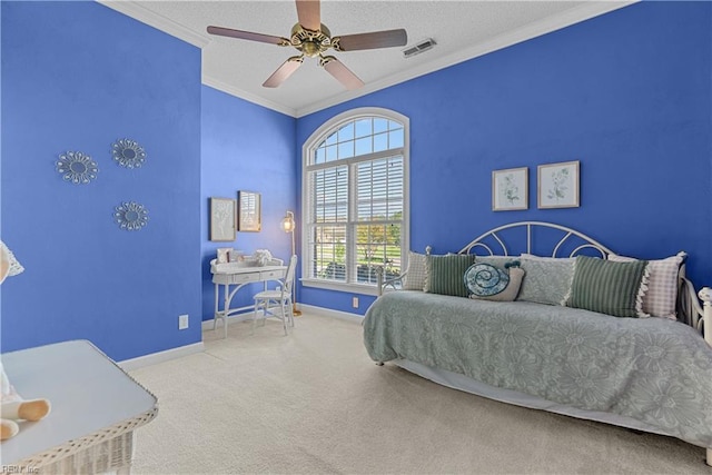 bedroom with a ceiling fan, visible vents, crown molding, carpet floors, and baseboards