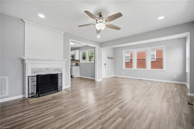 237 Pochin Pl, Hampton, VA 23661 - unfurnished living room featuring ceiling fan, wood finished floors, visible vents, and a fireplace
