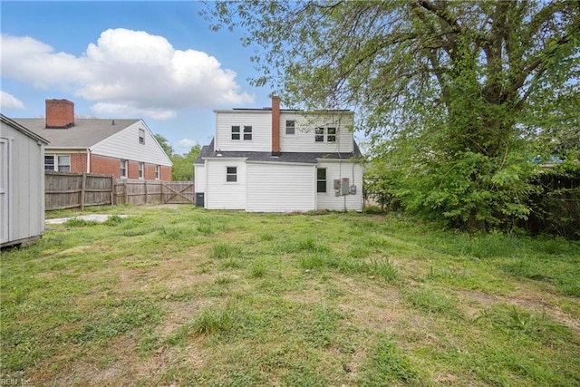 237 Pochin Pl, Hampton, VA 23661 - rear view of house featuring fence, a lawn, and a chimney