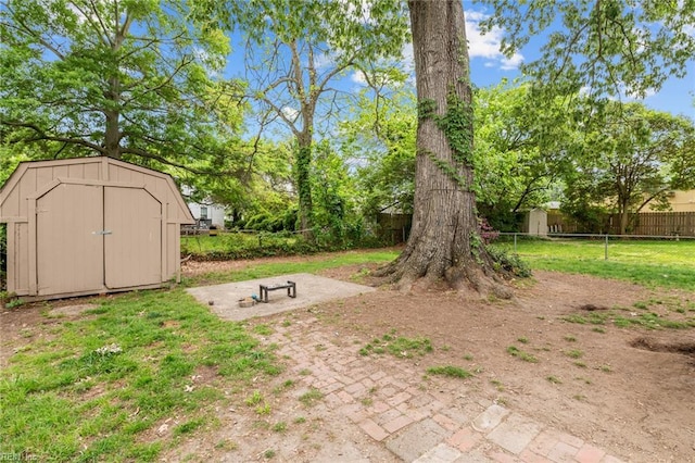 212 Cherokee Rd, Hampton, VA 23661 - view of yard with fence, an outbuilding, and a shed