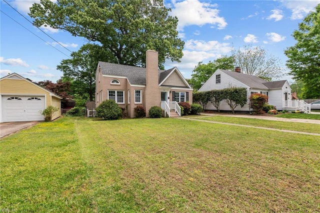 212 Cherokee Rd, Hampton, VA 23661 - view of front of property with a chimney, a front lawn, driveway, an outbuilding, and a garage
