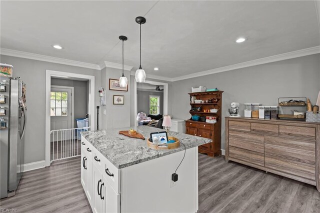 212 Cherokee Rd, Hampton, VA 23661 - kitchen featuring light wood finished floors, stainless steel refrigerator with ice dispenser, a center island, and white cabinets