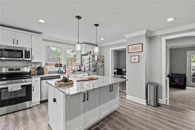 212 Cherokee Rd, Hampton, VA 23661 - kitchen with white cabinets, a wealth of natural light, crown molding, and stainless steel appliances