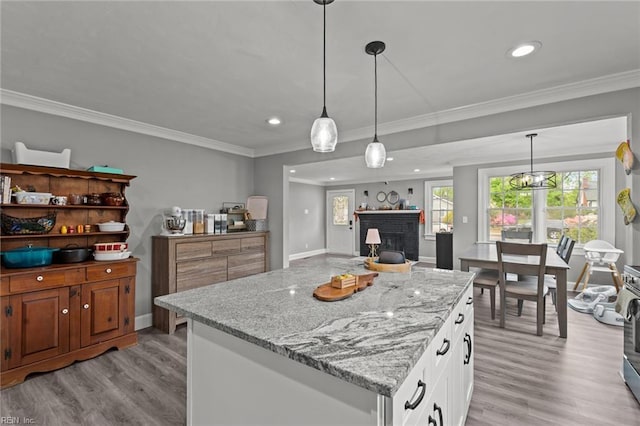 212 Cherokee Rd, Hampton, VA 23661 - kitchen featuring light wood-type flooring, recessed lighting, white cabinetry, pendant lighting, and light stone counters