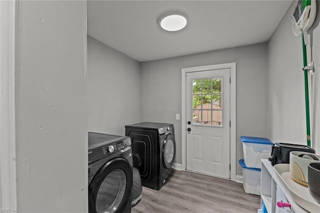 212 Cherokee Rd, Hampton, VA 23661 - laundry area with washing machine and dryer, baseboards, laundry area, and light wood-type flooring