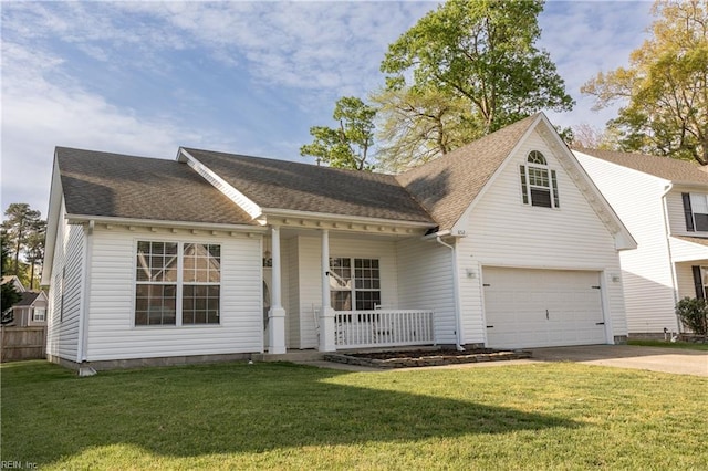 view of front of house with a porch, driveway, an attached garage, and a front yard