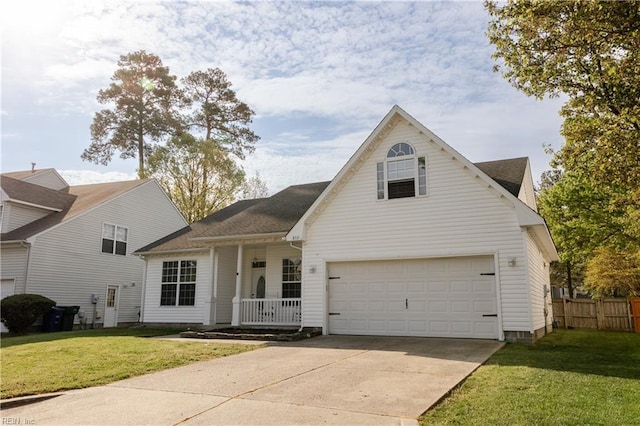 traditional home with fence, a porch, a front yard, and an attached garage