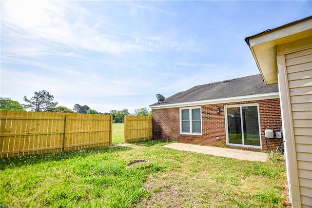 view of yard featuring a patio and fence