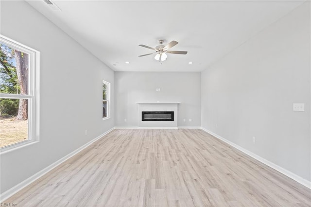 6471 Swan Arch, Norfolk, VA 23513 - unfurnished living room featuring light wood-type flooring, a ceiling fan, and baseboards