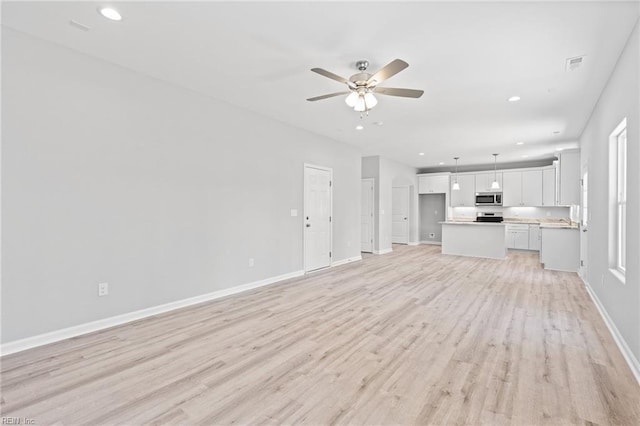 6471 Swan Arch, Norfolk, VA 23513 - unfurnished living room featuring baseboards, light wood-type flooring, a ceiling fan, and recessed lighting