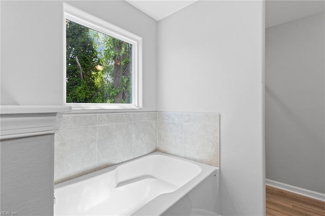 6471 Swan Arch, Norfolk, VA 23513 - bathroom featuring wood finished floors and a bath