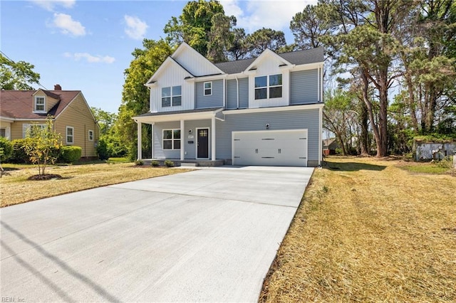 6471 Swan Arch, Norfolk, VA 23513 - view of front facade with driveway, board and batten siding, covered porch, a front yard, and a garage