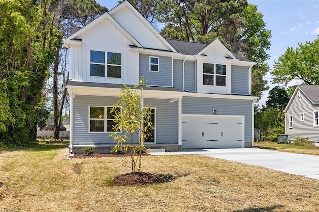 6471 Swan Arch, Norfolk, VA 23513 - view of front of house with a front lawn, a garage, covered porch, board and batten siding, and concrete driveway
