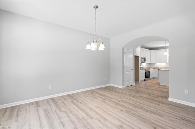 6471 Swan Arch, Norfolk, VA 23513 - interior space with an inviting chandelier, baseboards, and light wood-style floors