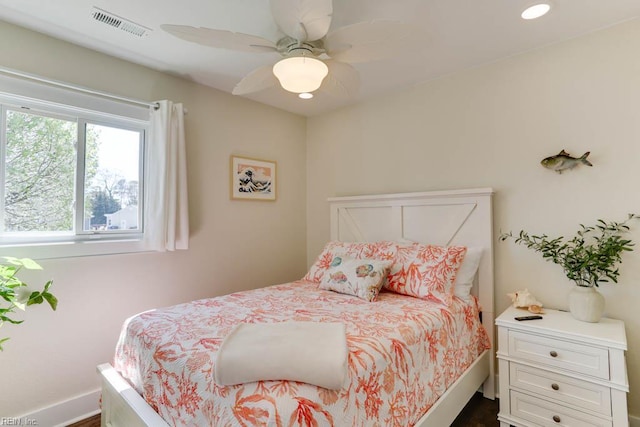 bedroom featuring a ceiling fan, baseboards, dark wood-type flooring, visible vents, and recessed lighting