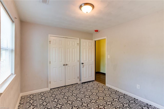 20 Mac Alva Dr, Hampton, VA 23669 - unfurnished bedroom with baseboards, multiple windows, and a closet