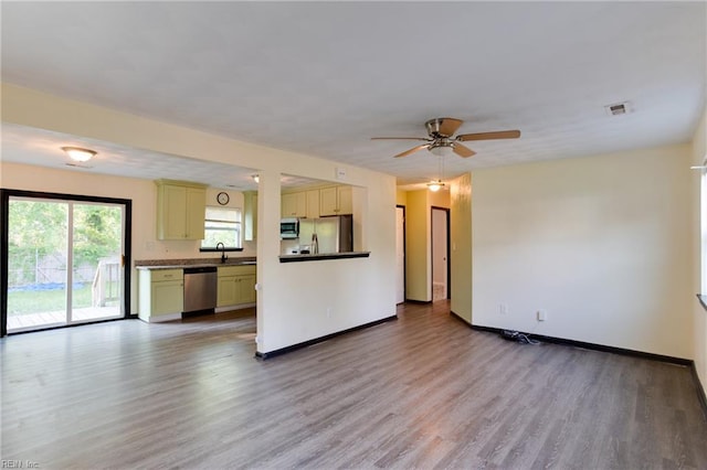 20 Mac Alva Dr, Hampton, VA 23669 - kitchen with light wood-type flooring, cream cabinets, visible vents, dark countertops, and appliances with stainless steel finishes