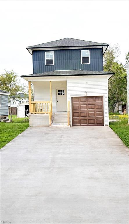 628 Brook Ave, Suffolk, VA 23434 - view of front of property with a front lawn, driveway, a porch, an attached garage, and board and batten siding