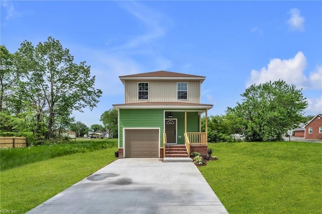 american foursquare style home featuring a front lawn, driveway, a porch, and an attached garage