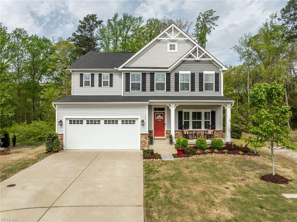 9589 Goddin Ct, Toano, VA 23168 - craftsman inspired home with an attached garage, covered porch, driveway, and a front yard