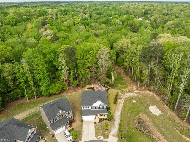 drone / aerial view featuring a view of trees