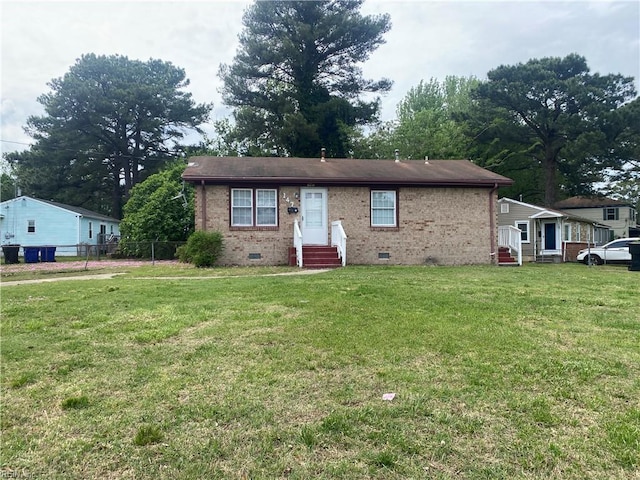 bungalow-style home with brick siding, entry steps, a front lawn, and crawl space