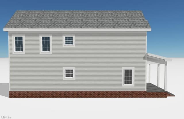 exterior space featuring roof with shingles