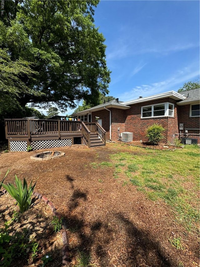 521 N Shore Rd, Norfolk, VA 23505 - rear view of property with a deck, cooling unit, a yard, and brick siding