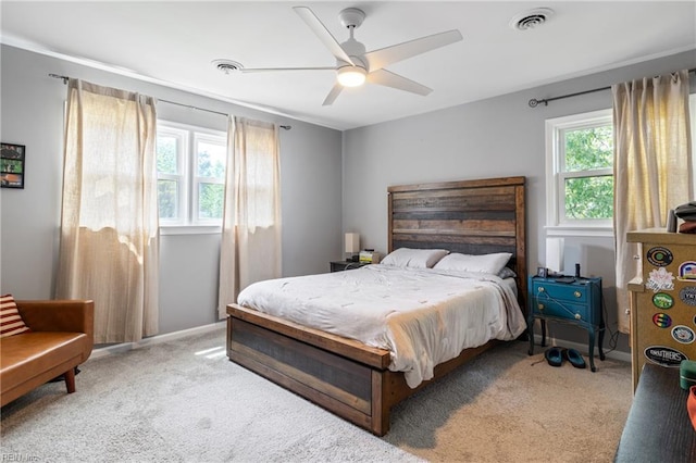 bedroom with ceiling fan, carpet floors, and visible vents