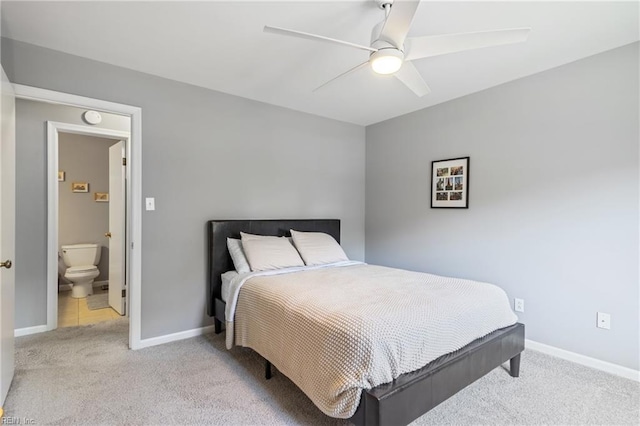 carpeted bedroom with baseboards and a ceiling fan