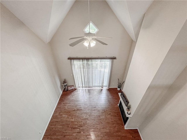 1004 Christiana Cir, Portsmouth, VA 23703 - unfurnished room with baseboards, wood finished floors, high vaulted ceiling, and ceiling fan