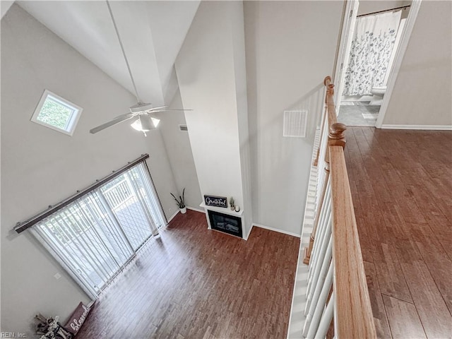 1004 Christiana Cir, Portsmouth, VA 23703 - unfurnished living room with ceiling fan, baseboards, wood finished floors, and visible vents