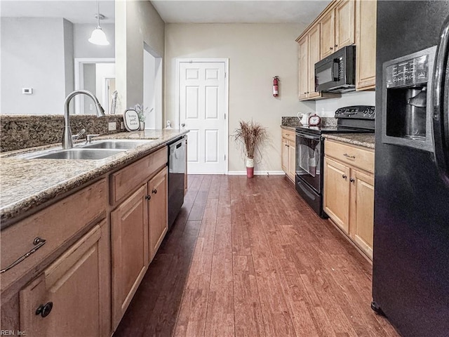 1004 Christiana Cir, Portsmouth, VA 23703 - kitchen with light brown cabinetry, a sink, baseboards, black appliances, and dark wood-style flooring