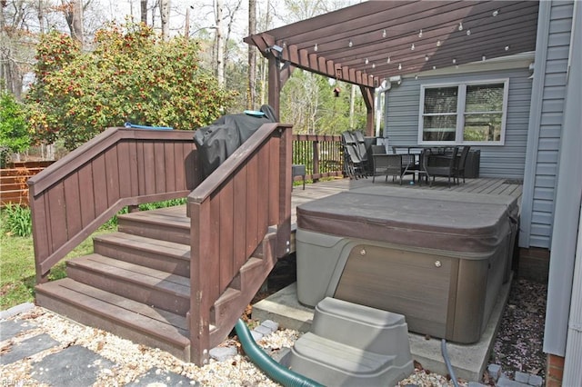 wooden deck with a pergola, a hot tub, and outdoor dining space