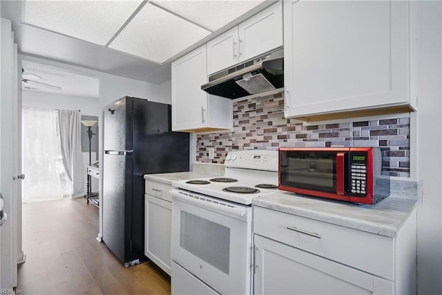 kitchen featuring white electric range oven, white cabinetry, light countertops, and under cabinet range hood