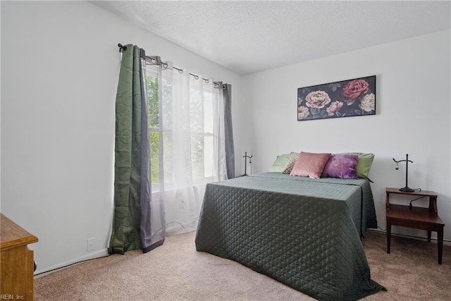 carpeted bedroom with a textured ceiling