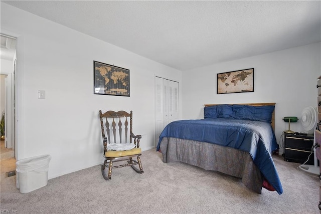 carpeted bedroom featuring a closet