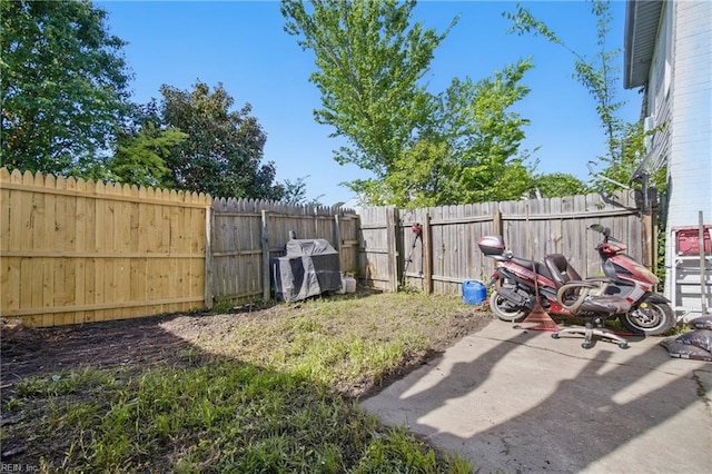 view of yard with a fenced backyard