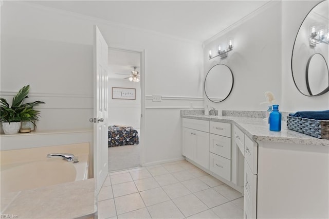 full bathroom with a ceiling fan, a bathing tub, vanity, ornamental molding, and tile patterned flooring
