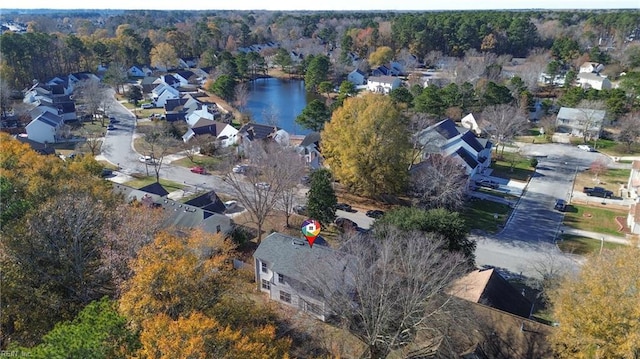 birds eye view of property featuring a residential view and a water view