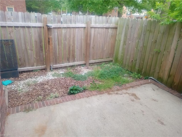 view of yard featuring fence and a patio area