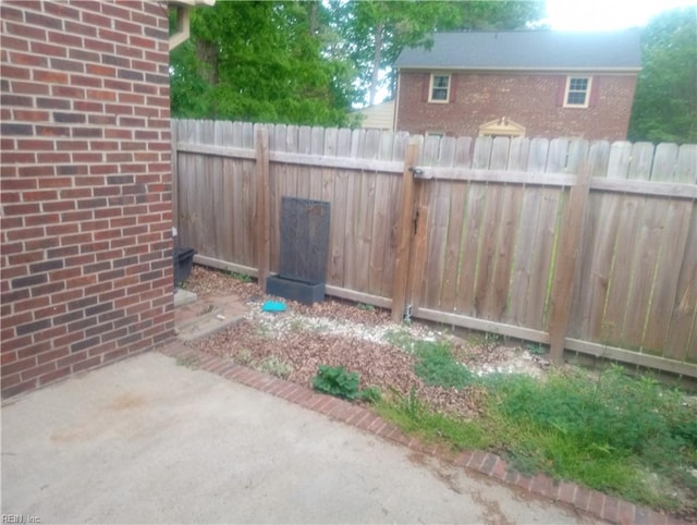 view of yard with fence and a patio area