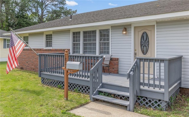 wooden deck with a yard