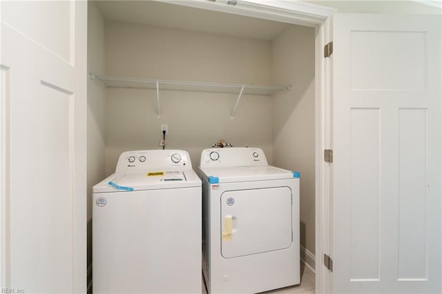 laundry room featuring washer and clothes dryer and laundry area