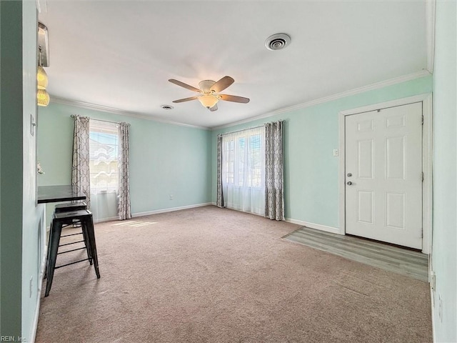 interior space with a wealth of natural light and ornamental molding